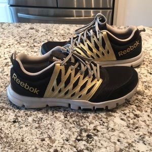 Reebok black and gold